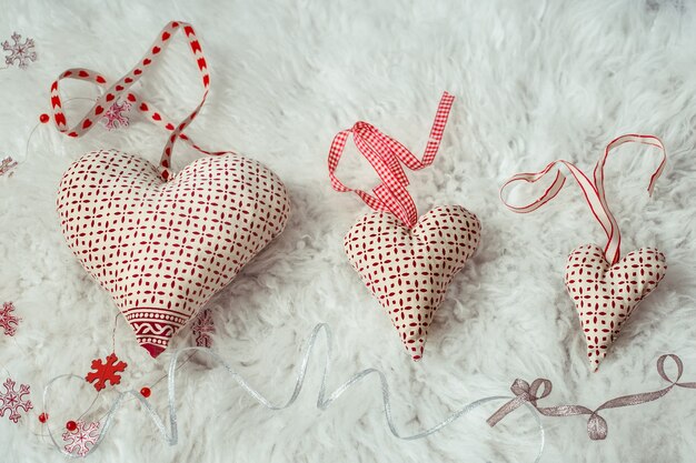 Hearts made of handmade fabric, top view, flat lay.