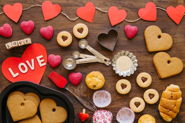 Hearts near bakeware and baked food