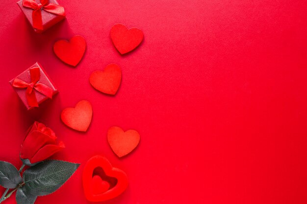 Hearts and presents on red background