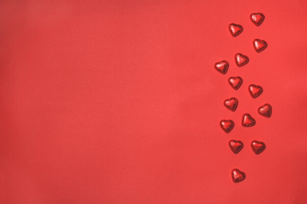 Hearts on a red background