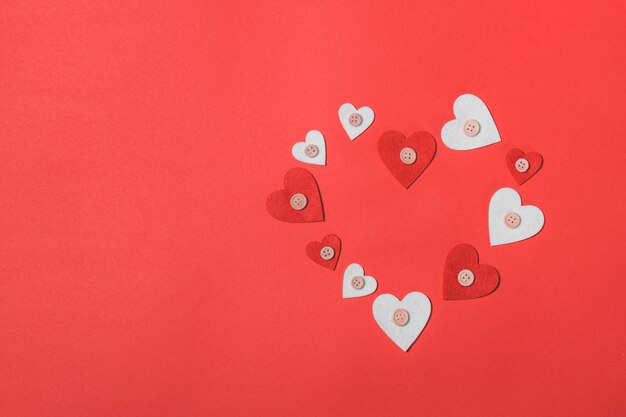 Hearts on a red background