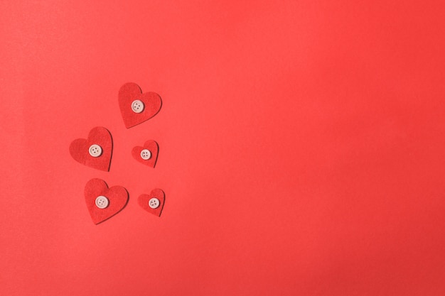 Hearts on a red background