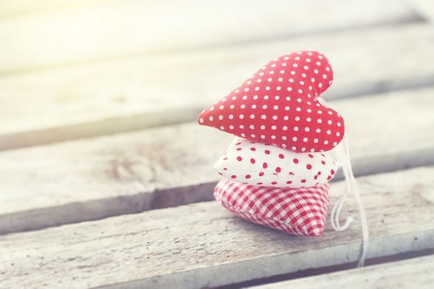 Hearts stacked on a wooden table