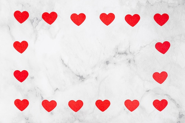 Free photo hearts surrounding marble copy space