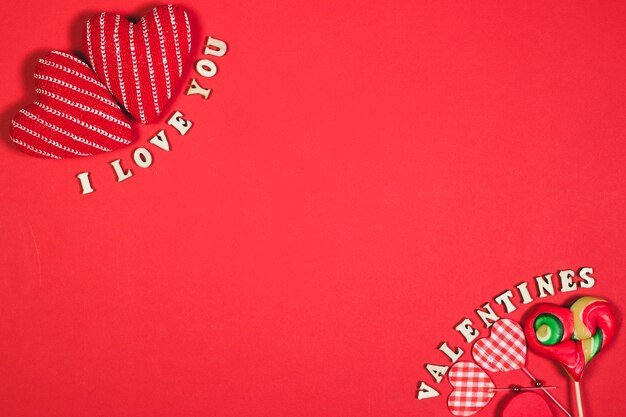 Hearts and writings on red background