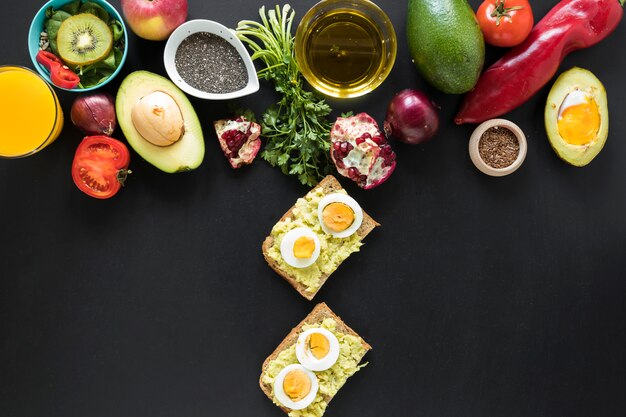 Heathy food and ingredients on black background