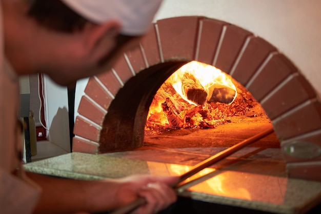 Download Free Pizzas Baking In An Open Firewood Oven Premium Photo Use our free logo maker to create a logo and build your brand. Put your logo on business cards, promotional products, or your website for brand visibility.