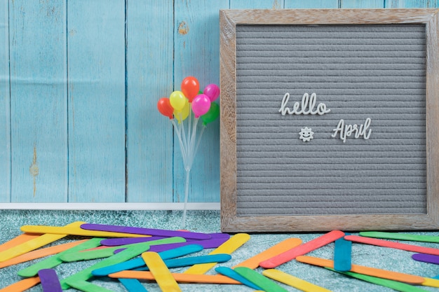 Hello april poster on grey surface