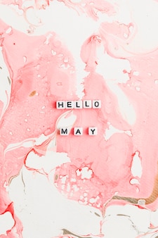 Hello may beads word typography on pink