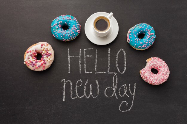 Free photo hello new day with doughnut collection