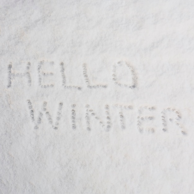 Free photo hello winter words on snow