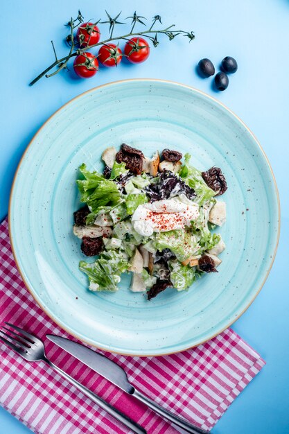 Herb salad topped with sour cream