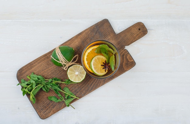 Herbal tea,lime and mint on a cutting board
