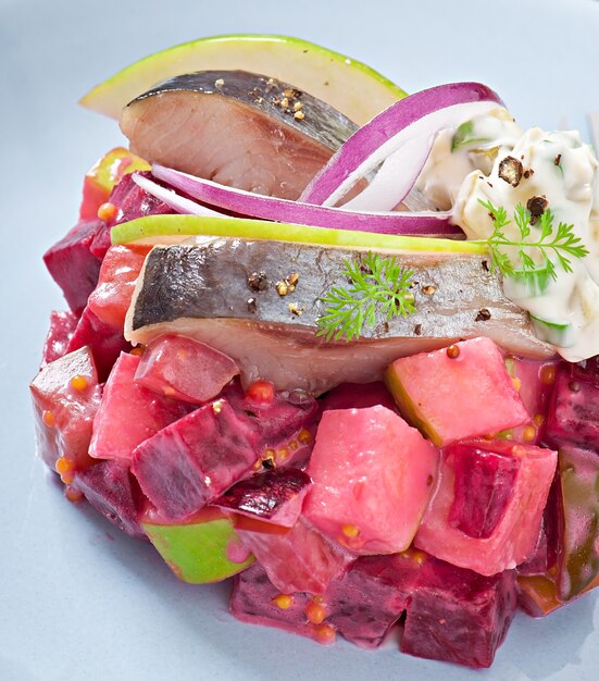 Herring salad with sour cream sauce