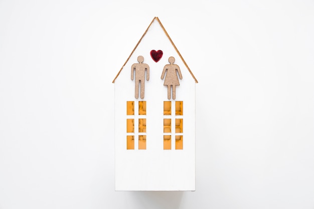 Free photo heterosexual couple on toy house