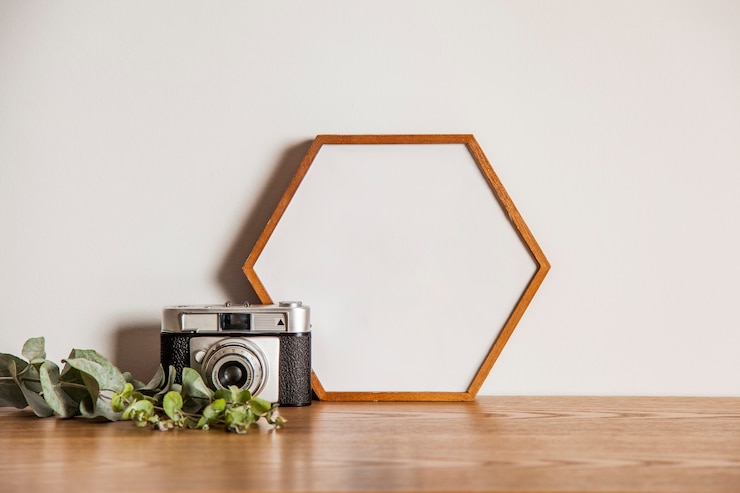 Free Photo hexagonal frame and camera