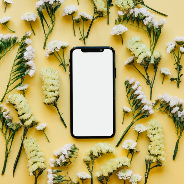 Hi-tech smartphone in soft flowers