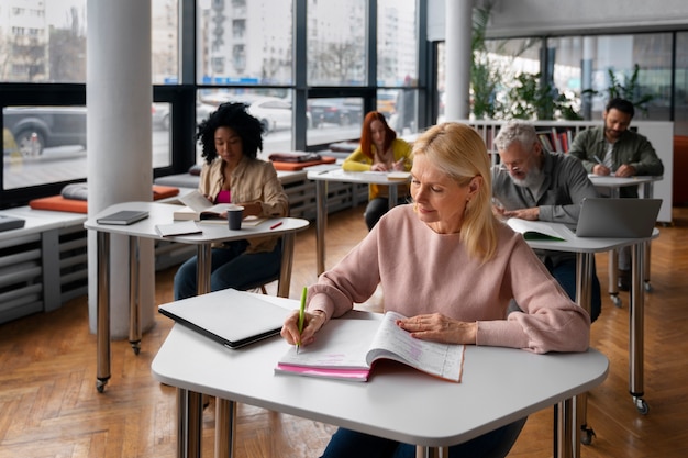 High angle adults studying together