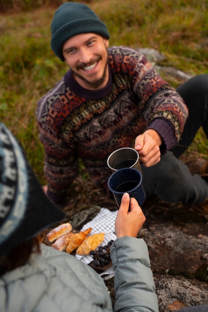 Free photo high angle adventurous couple bivouacking