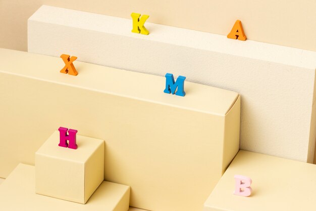 High angle of alphabet letters on podium for education day