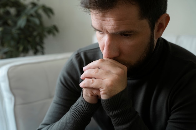 Free photo high angle anxious man at home