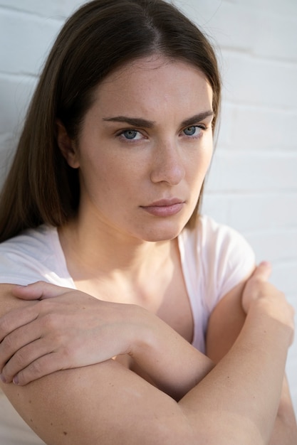 Free photo high angle anxious woman at home