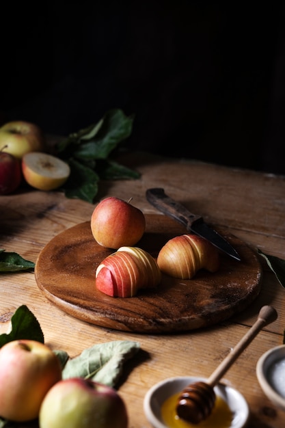 High angle apple slices on wooden board