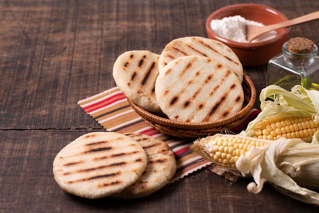 High angle arepas on wooden table