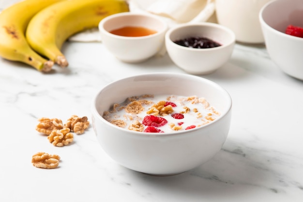 High angle arrangement of healthy bowl cereals and ingredients