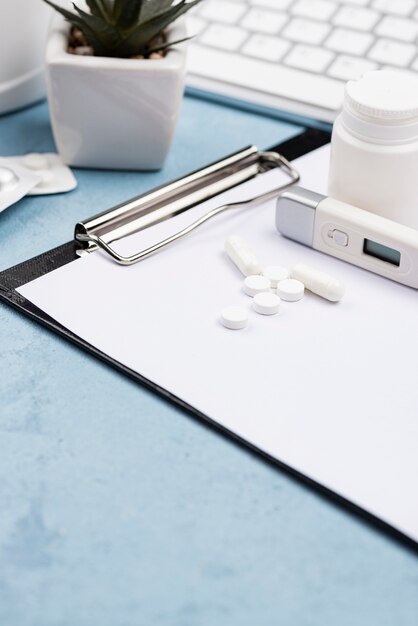 High angle arrangement of medical objects on blue background