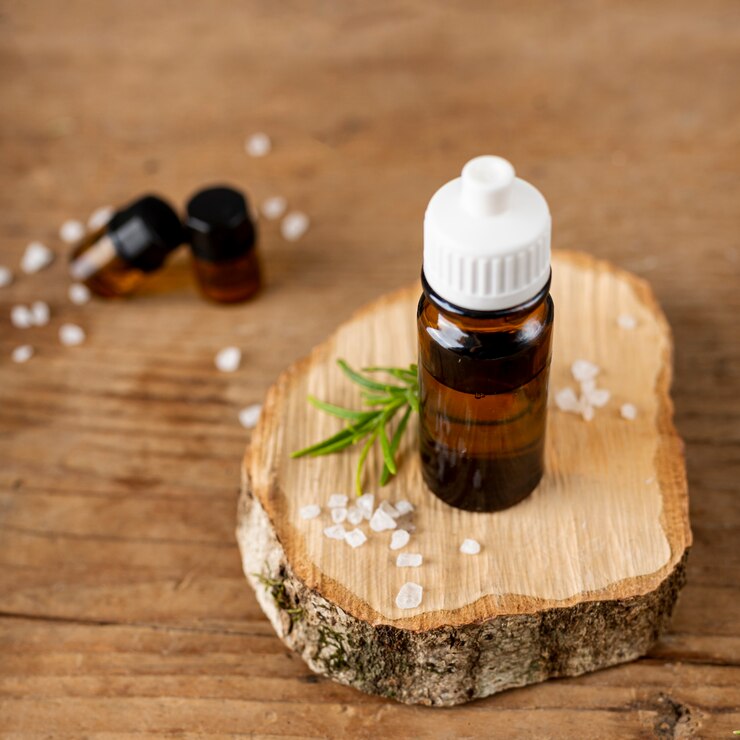 Free Photo high angle arrangement with bottles of oil