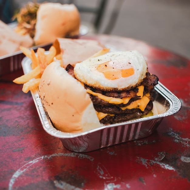 High angle arrangement with cheeseburger and fries