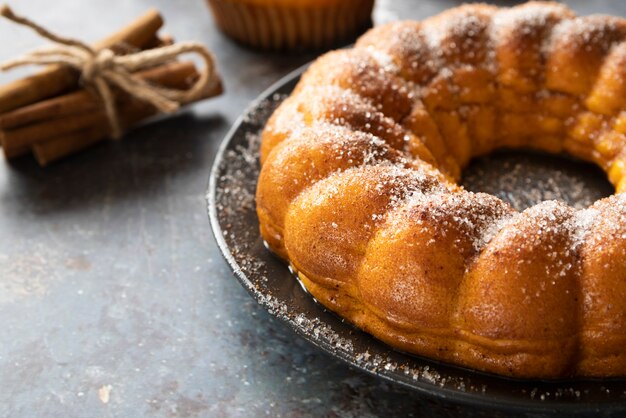 High angle arrangement with delicious pie and cinnamon sticks