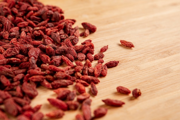 Free photo high angle arrangement with dried fruits on wooden background