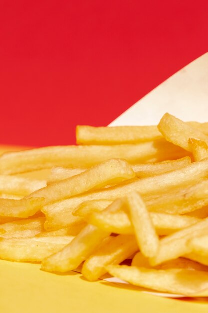 High angle arrangement with fries and red background