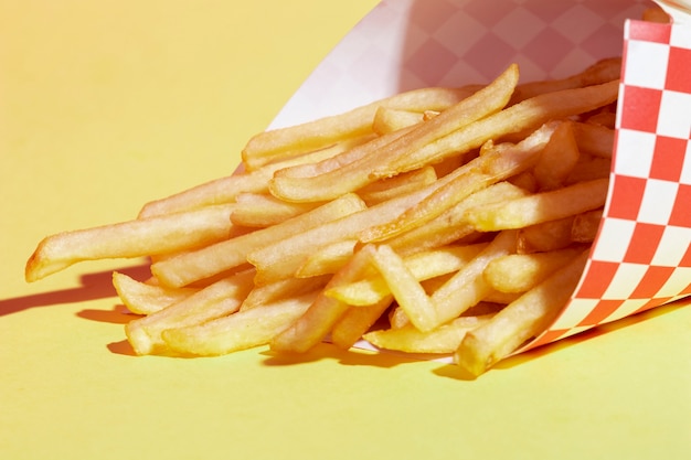 High angle arrangement with fries and yellow background