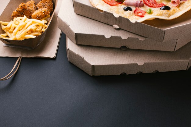 High angle arrangement with pizza and fries