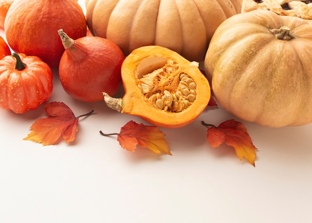 High angle arrangement with pumpkins and white background