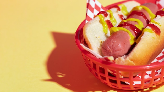 High angle arrangement with tasty hot dog in basket 