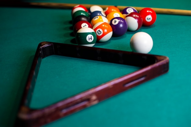 High angle arrangement with triangle and pool balls