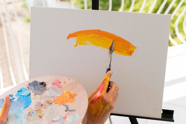 Free Photo high angle of artist painting