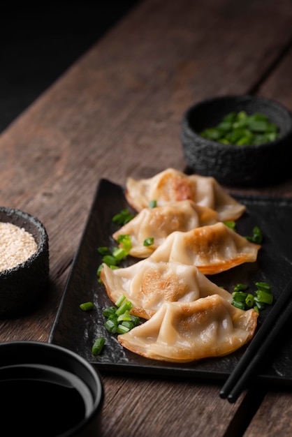 High angle of asian dish on plate with herbs