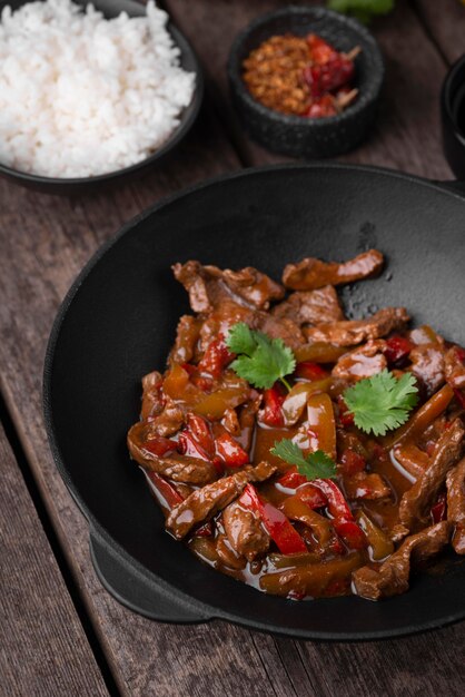 High angle of asian dish on plate with meat and rice