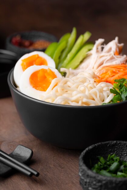 High angle of asian dish with eggs and salad in bowl