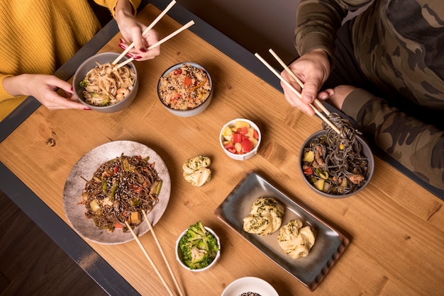 High angle of assortment of asian food on table