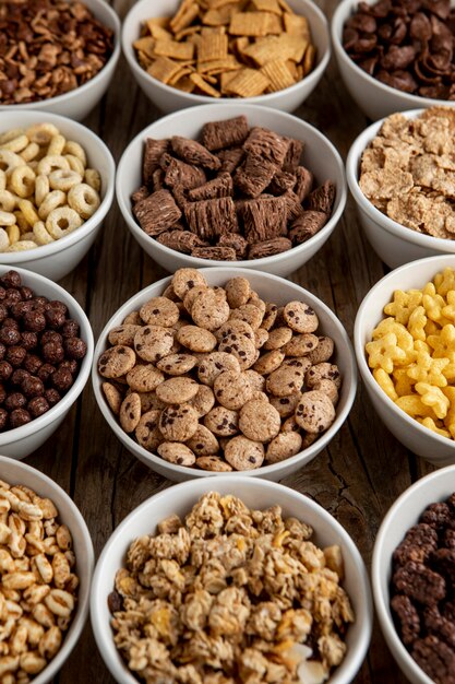 High angle of assortment of breakfast cereals in bowls