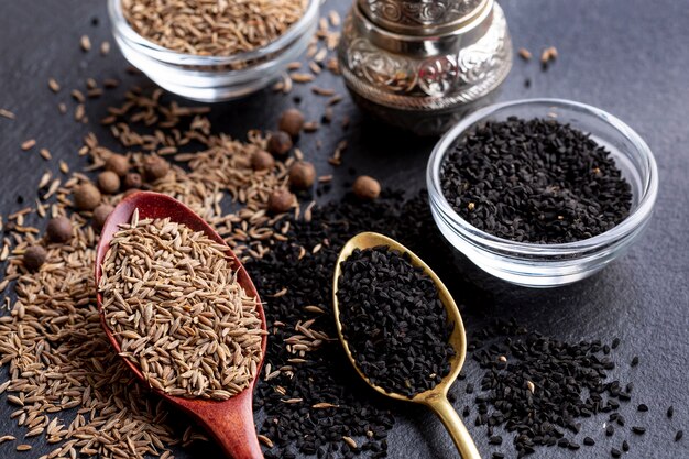 High angle of assortment of spices with grinder