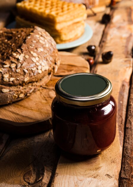 High angle assortment with baked food and jam jar