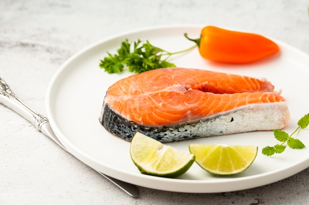 Free photo high angle assortment with delicious fish and lime