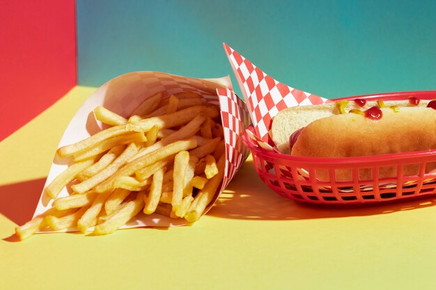 High angle assortment with fries and hot dog in basket